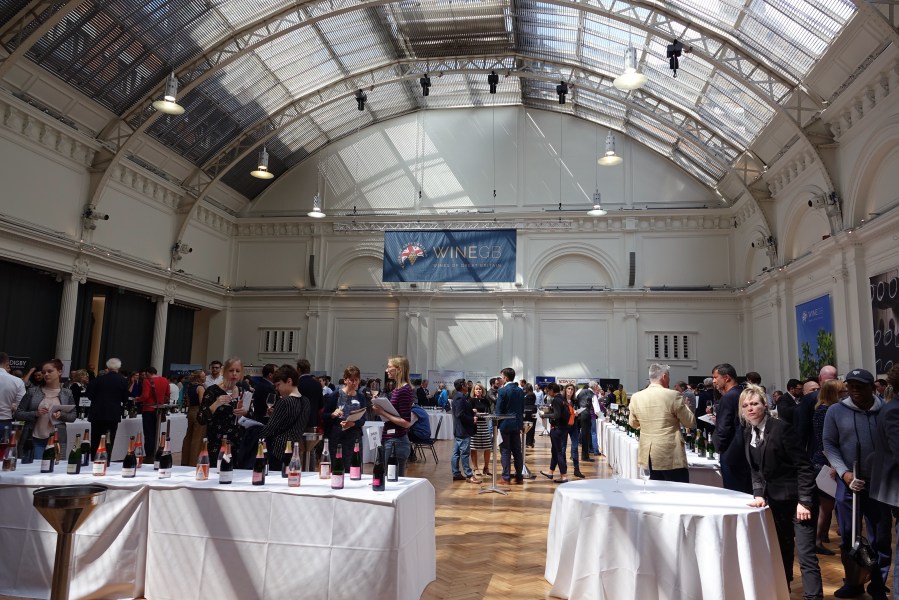 Hall full of people wine tasting